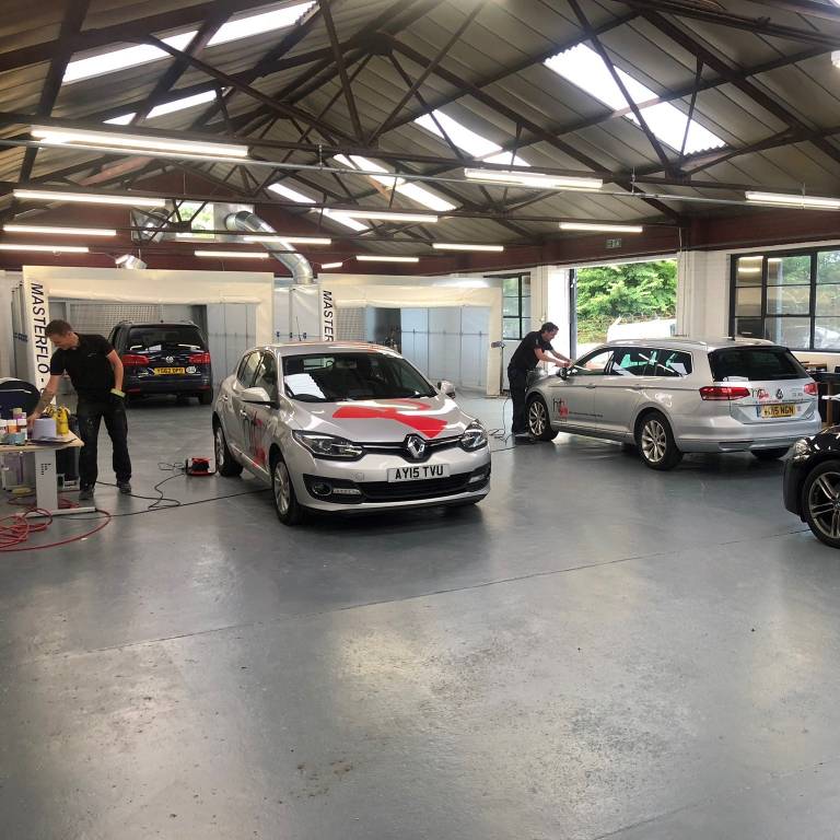 Technicians working at Revive! Brighton car repair centre